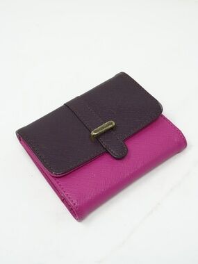 Cute small purple and pink bifold wallet features a textured finish